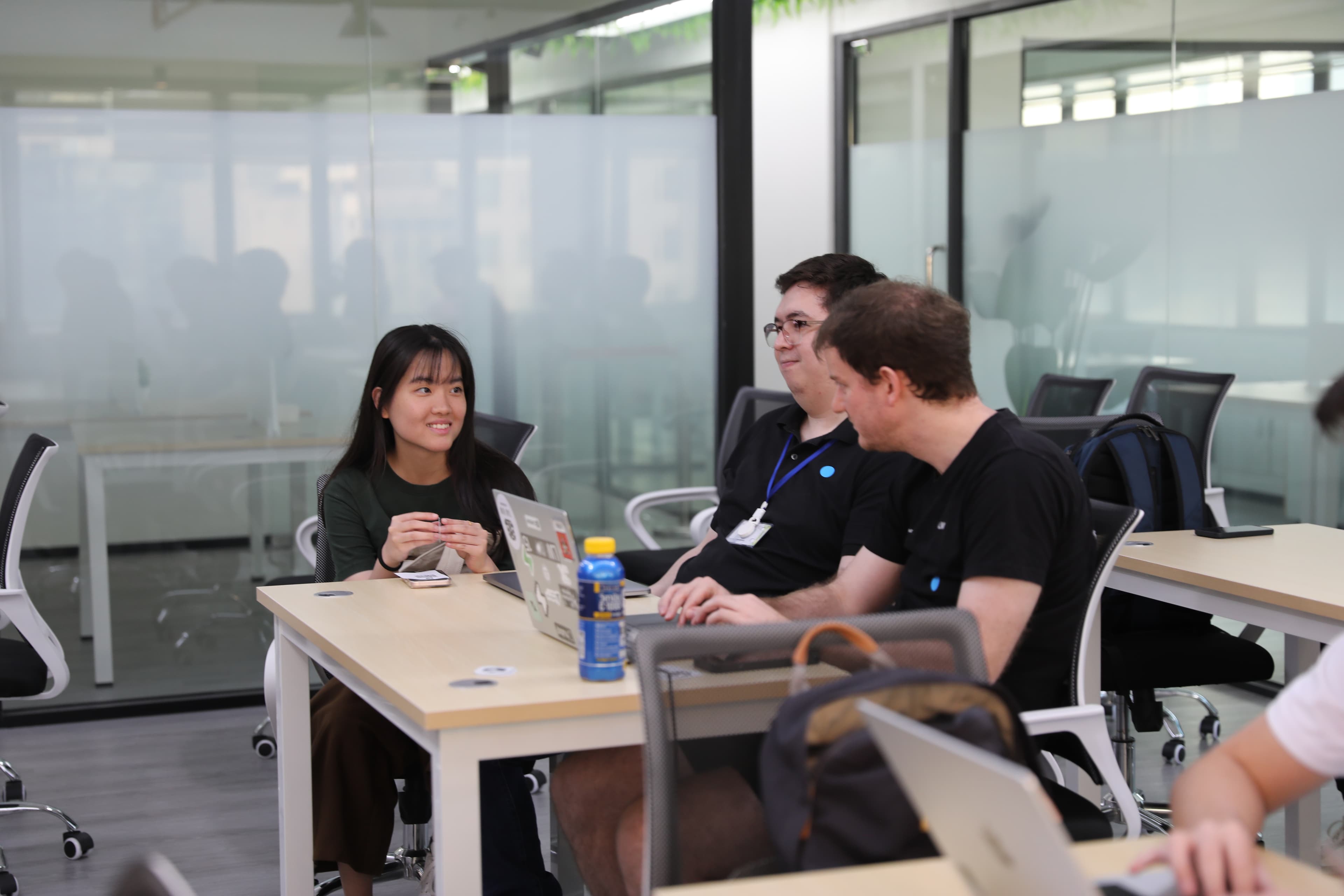 Three people in close conversation